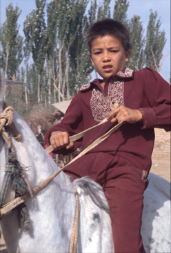 Young man at animal market in Kasgar, China.